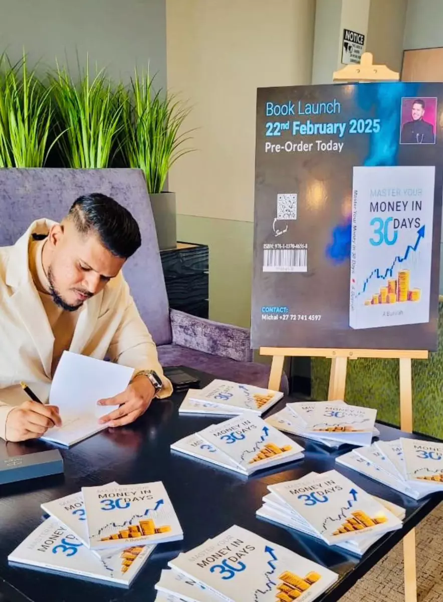 Avishek signing copies of his book at the launch